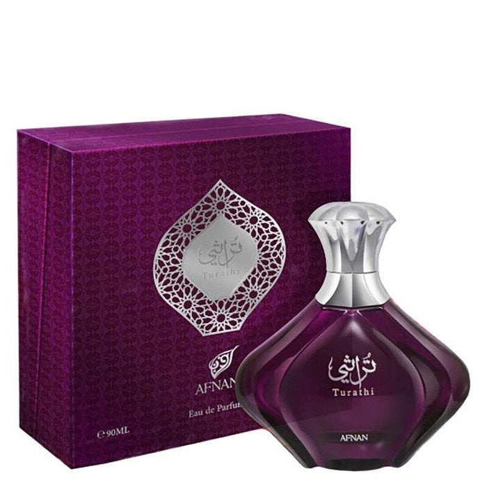 Afnan Turathi Purple perfume in a deep purple glass bottle with a silver sculpted cap and matching patterned box.