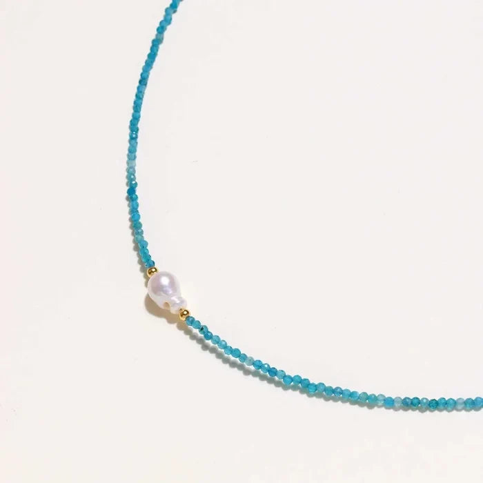 Apatite Pearl Strand Necklace with tiny faceted turquoise-blue beads, a single white pearl centerpiece and gold-tone accents