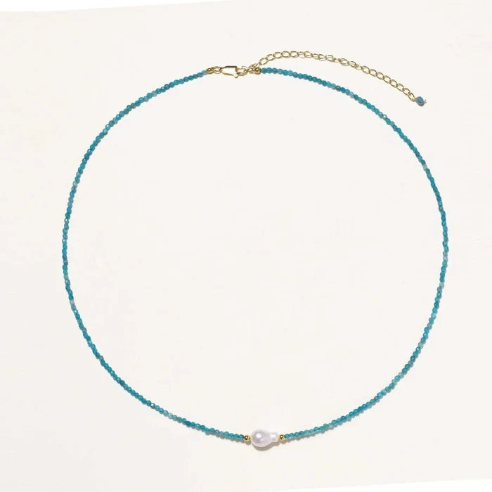 Apatite Pearl Strand Necklace with tiny teal beads, a white pearl centerpiece and gold-tone clasp and extender chain