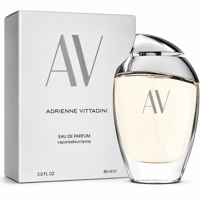 A.V. by Adrienne Vittadini Eau de Parfum in a clear glass bottle with silver cap beside a silver box