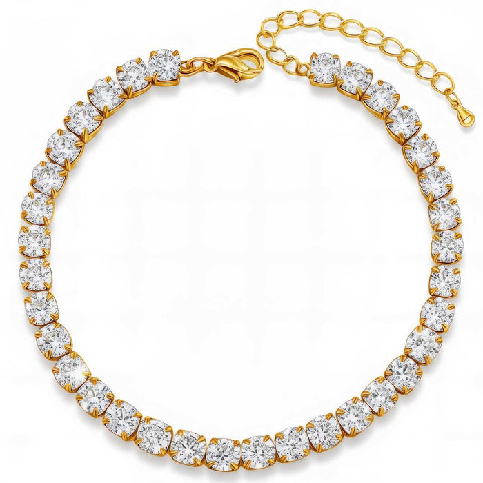Cubic Zirconia Tennis Bracelet in gold-tone metal with a continuous row of large clear heart-shaped stones and an extender chain