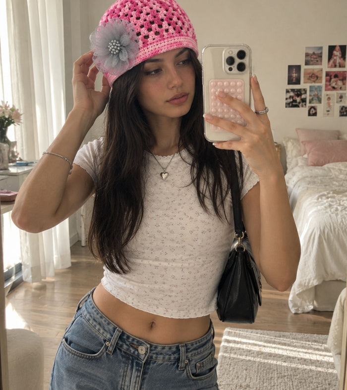 Pink crochet beanie with lattice texture and gray tulle flower detail