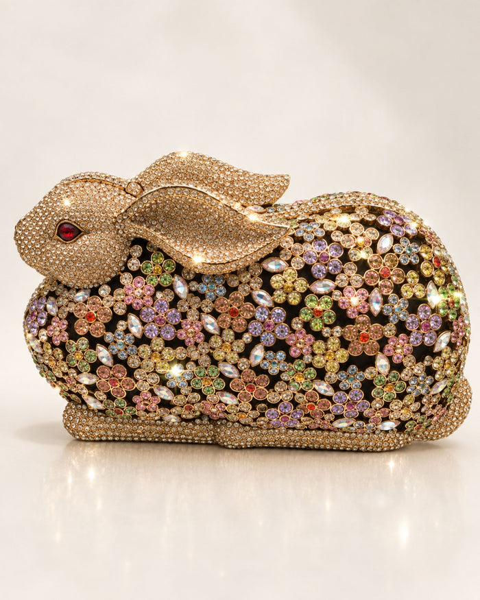 Gold crystal rabbit clutch with jeweled multicolor button eyes and rhinestone shell