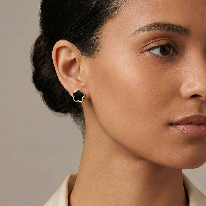 Flower Stud Earrings Style 1 in a black flower shape with a gold-tone metal outline, worn as a floral stud.