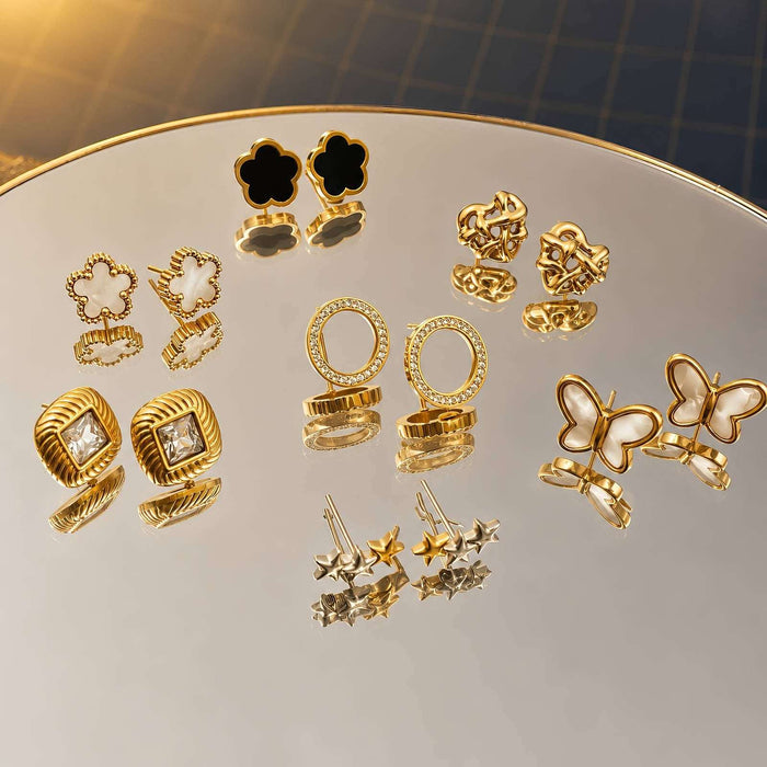 Flower Stud Earrings Style 1 with black four-petal flower centers and polished gold-tone outlines in a stud design
