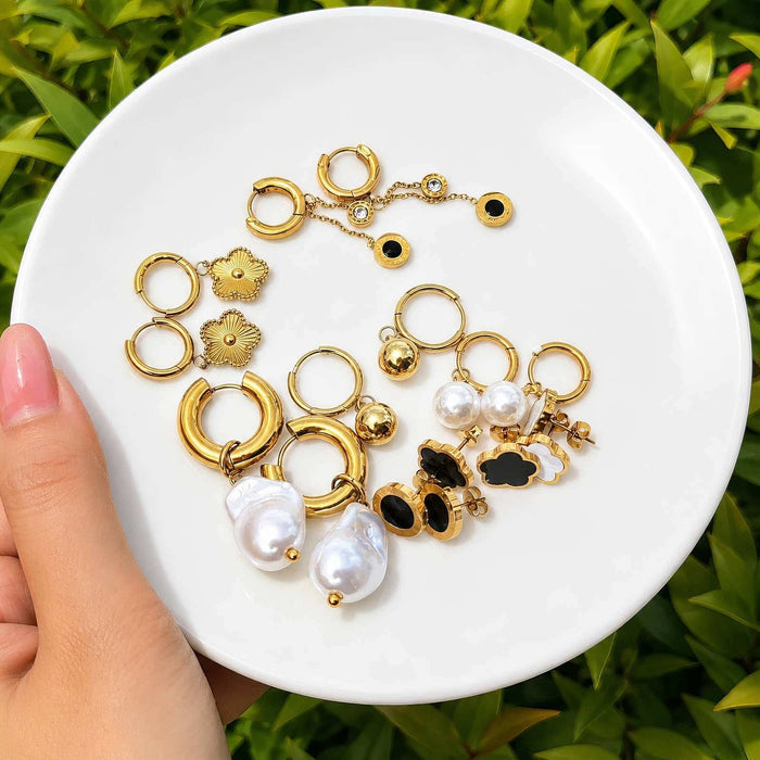 Flower Stud Earrings Style 1, gold-tone floral studs mixed with hoop and pearl earrings in a jewelry assortment