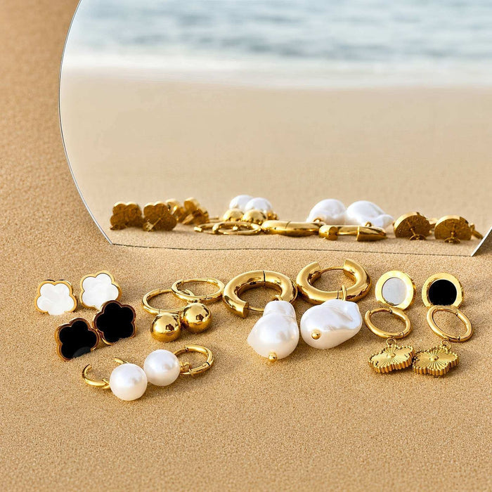 Flower Stud Earrings Style 2, gold-tone floral studs with white and black clover-shaped faces among assorted gold earrings