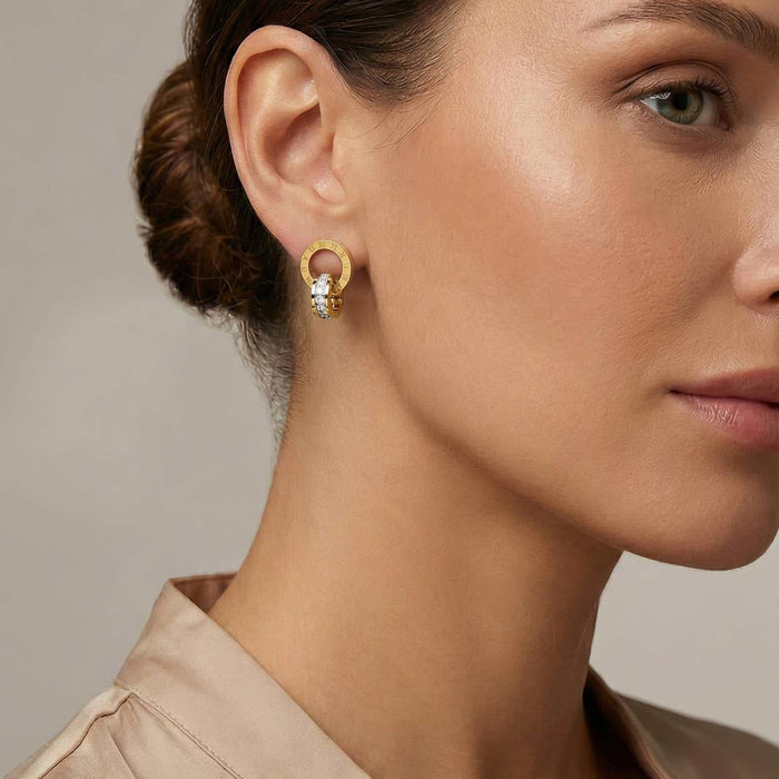 Gold Steel Stud Earrings featuring a small gold hoop with a dangling cluster of sparkling clear stones