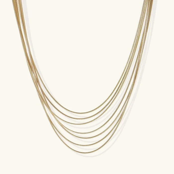 Golden Hour Seven-Strand Necklace in gold-tone plated metal, with seven fine graduated chains forming layered curves.