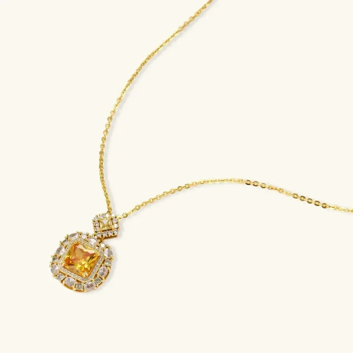Golden Square Zirconia Necklace with a gold-tone chain and square amber centre framed by clear sparkling stones