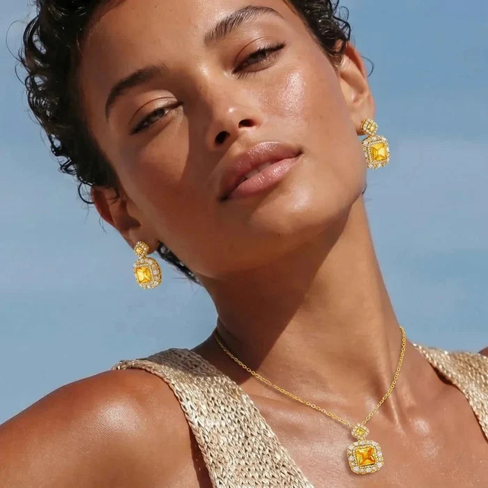 Golden Square Zirconia Necklace with matching gold drop earrings, featuring square amber-toned centres and sparkling clear stones