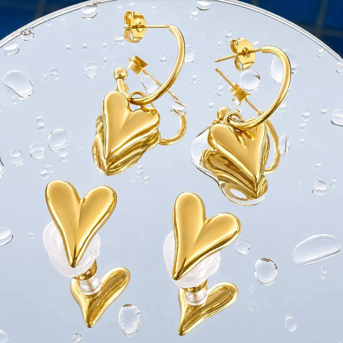 Heart Stud Earrings featuring polished gold-tone heart-shaped fronts and curved stud backs with raised layered detailing