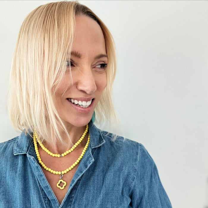 katia wearing the yellow ad necklace