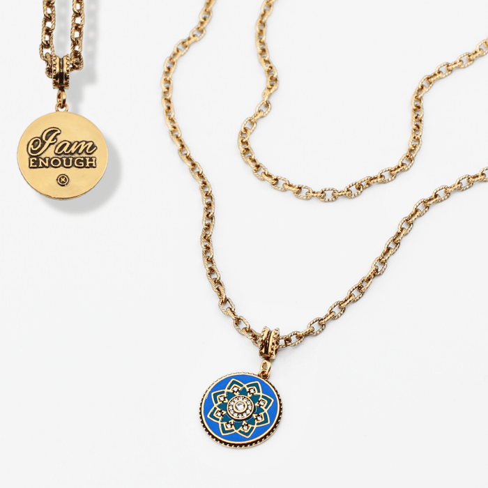 Two gold necklaces with pendants on a white background