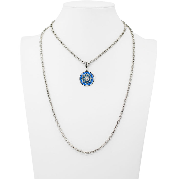 Necklace with a blue and silver pendant on a mannequin bust against a white background