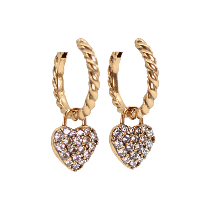 Gold hoop earrings with heart-shaped charms on a white background