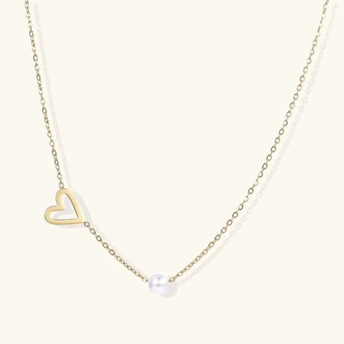 Pearl Heart Embrace Necklace with a delicate gold-tone chain, open heart charm and single round white pearl