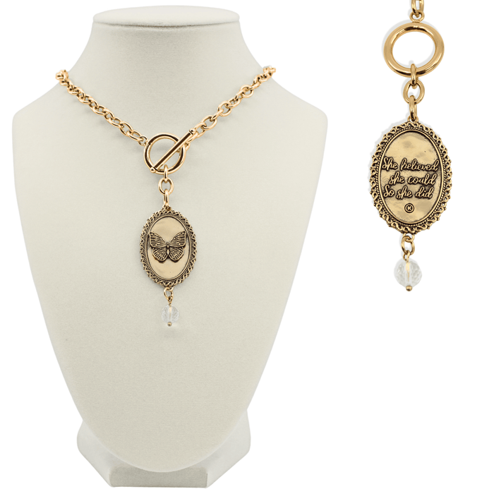 Gold necklace with pendant on a mannequin bust and close-up on a white background