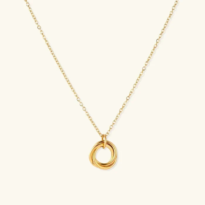 Twisted Harmony 18K Gold-Plated necklace with a fine gold-tone chain and pendant of three smooth interlocking rings