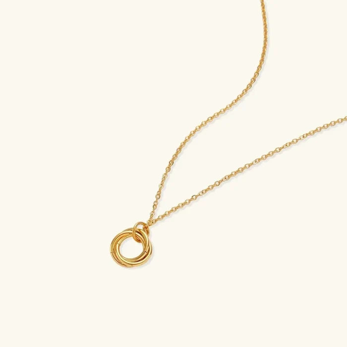 Twisted Harmony 18K Gold-Plated necklace with a fine gold-tone chain and three smooth interlocking rings
