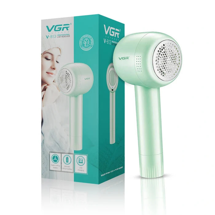 A rechargeable lint remover by VGR, shown next to its packaging. The device is light green in color, with a sleek design, and the packaging includes a picture of a woman using the product.